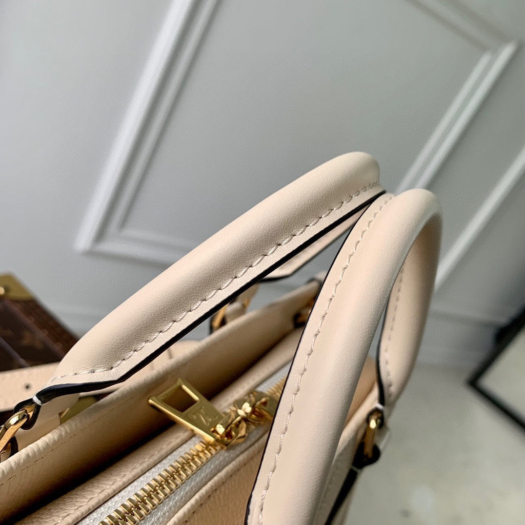 SAC ONTHEGO EST-OUEST 25 EN CUIR DE VACHE BEIGE MONOGRAMMÉ EN GAUFRAGE