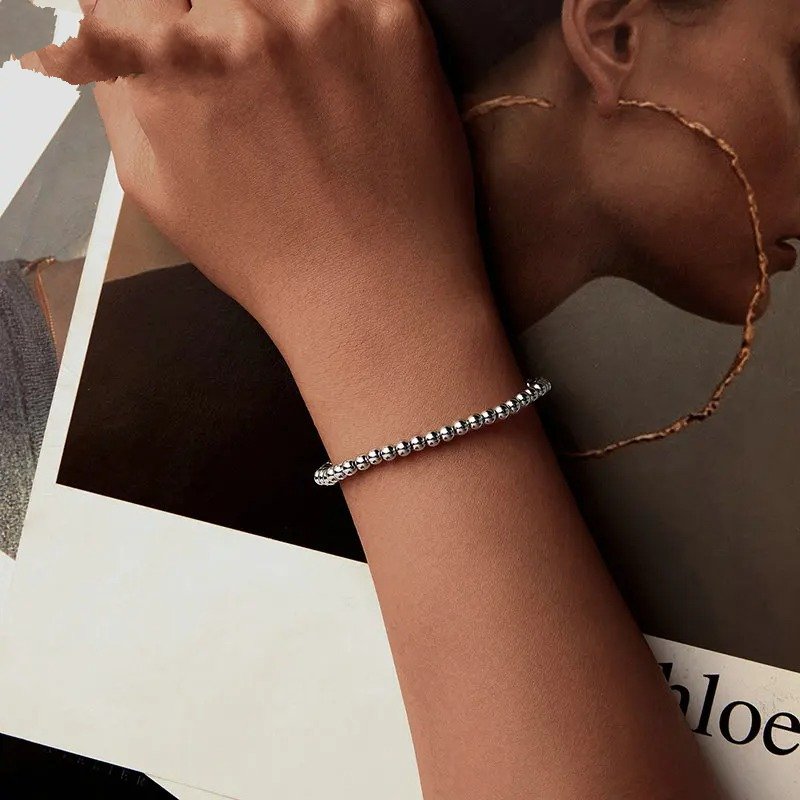 Bracelet à billes extensible et élastique en or blanc